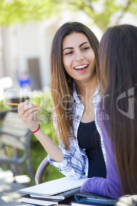 Expressive Young Mixed Race Female Sitting and Talking with Girl