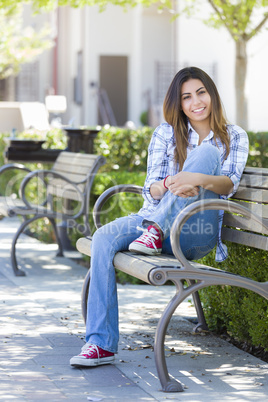 Mixed Race Female Student Portrait on School Campus Bench