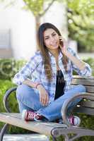 Mixed Race Female Student Portrait on School Campus Bench
