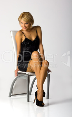 young girl on the chair in studio