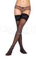 slender female legs in black stockings