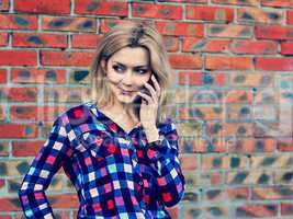 young blond girl talking on the phone