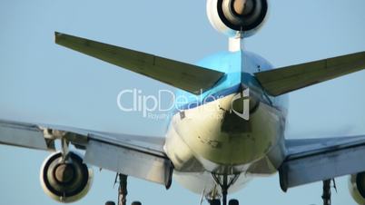 three engine airplane landing backview 11009
