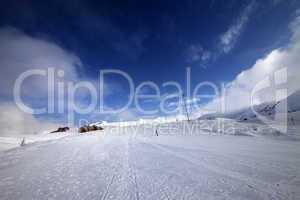 snowboarder on piste slope in nice day
