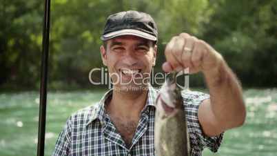 1of8 Man with rod fishing trout on river in Italy