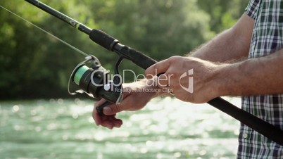 3of8 Man with rod fishing trout on river in Italy