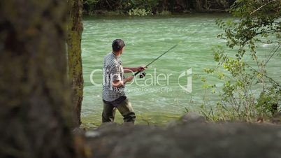 5of8 Man with rod fishing trout on river in Italy