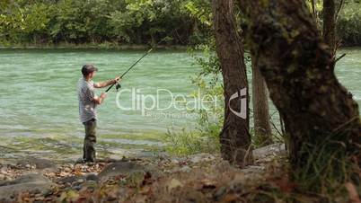 6of8 Man with rod fishing trout on river in Italy