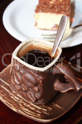 cup of coffee and portion cake