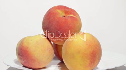 Juicy peaches on white background.