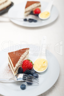 tiramisu dessert with berries and cream