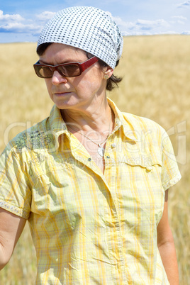 Organic farmer examines their corn field