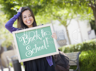 Mixed Race Female Student Holding Chalkboard With Back To School