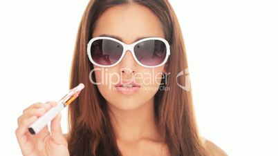 Beautiful woman smoking an e-cigarette