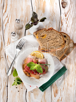 Bacon and bread on a wooden table