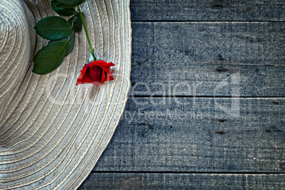 Womans summer hat with red rose