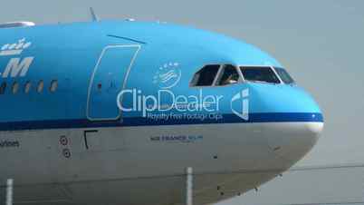 KLM airplane on taxiway pilot winking 11016