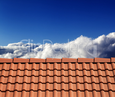roof tiles and sunny sky with clouds