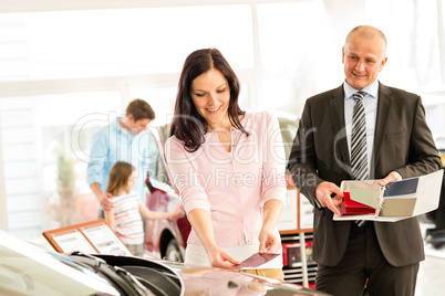 Woman choosing the color of family car
