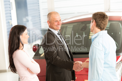 Caucasian couple purchasing a car