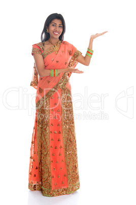 Indian woman showing empty space