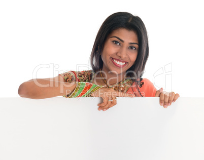 Indian woman holding blank placard