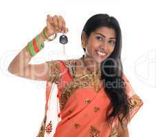 Indian woman holding car key