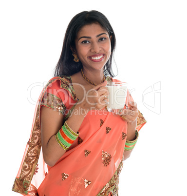 Indian woman drinking milk