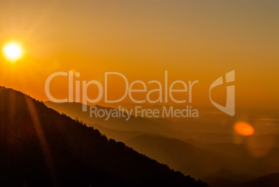 Sun rising over mountains of Smokies in early spring with