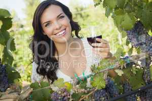 Young Adult Woman Enjoying A Glass of Wine in Vineyard