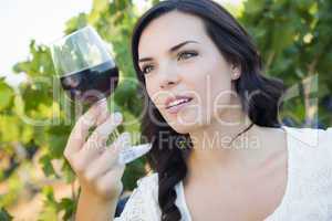 Young Adult Woman Enjoying A Glass of Wine in Vineyard