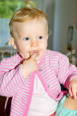 Toddler with finger in mouth