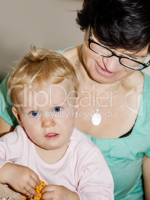 Mother holding toddler in her arms