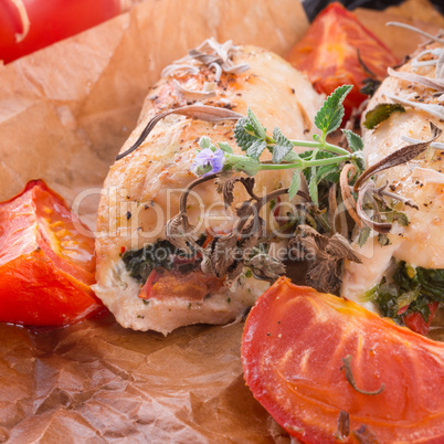 chicken breast with spinach, baked tomatoes and herbs