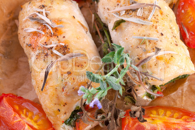 chicken breast with spinach, baked tomatoes and herbs