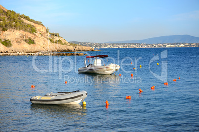 boats near beach at modern luxury hotel, peloponnes, greece