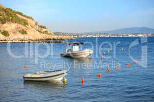 boats near beach at modern luxury hotel, peloponnes, greece