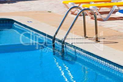 Ladder in the swimming pool