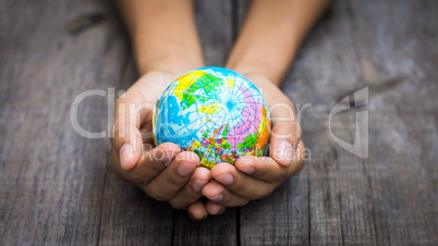 Person holding a world