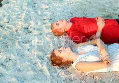 Lying on sand