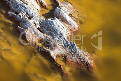 Limestone rocks sticking out of the water