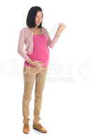 Pregnant Asian woman using computer tablet