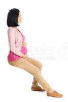 Side view pregnant Asian woman sitting