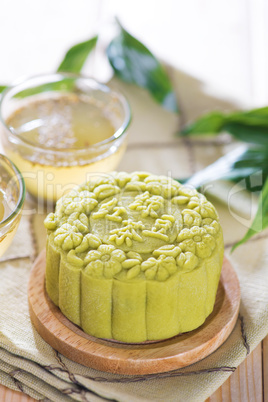 Green tea with red bean paste mooncake