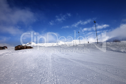 ski slope and hotel in winter mountains