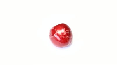 Rotating  cherry berry isolated on white background