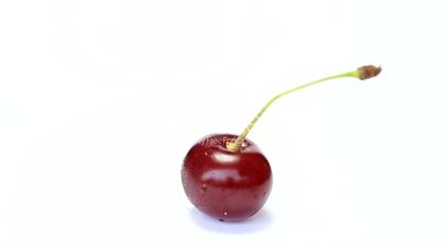 Rotating  cherry berry isolated on white background