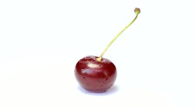 Rotating  cherry berry isolated on white background