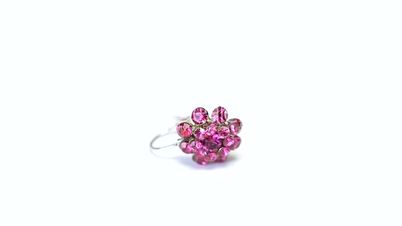 Pink earring rotating on white