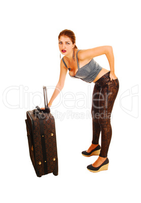 Worried girl with suitcase.